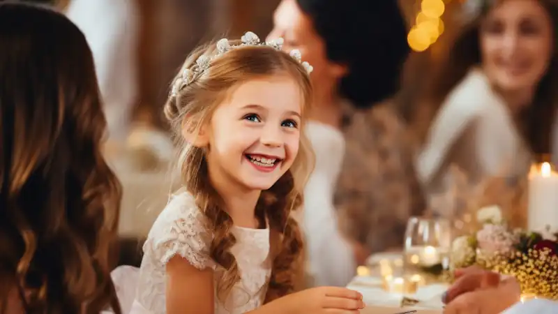 Fun Wedding Ideas for Children: A girl gives bride bracelet at wedding-reception.